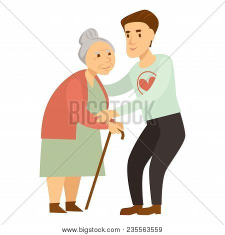 Kind Male Volunteer Helps Old Lady With Cane. Young Man In Sweater With Heart Assists Elderly Woman 
