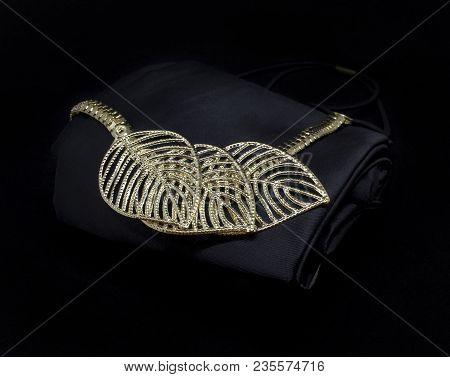 Gold Necklace With Leaves Isolated On Black