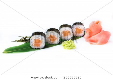 Delicious Fresh Mini-rolls With Salmon On A Banana Leaf. Sushi Rolls On A White Background With Ging