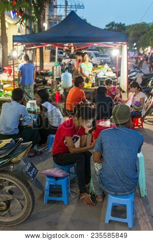 Monywa, Myanmar - October 9, 2016: Burmese people eating street foods in Monywa, Myanmar.