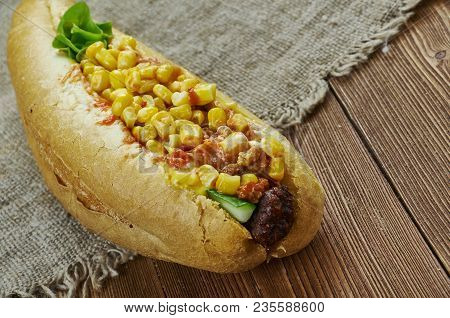 Texas Chili Dog -  Topped With Hearty Texas Chili, Freshly Grated Cheese And Chopped Sweet Onion.