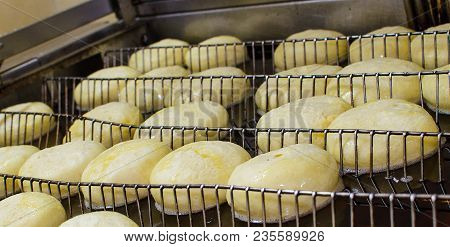 Preparation Of Donuts. Roasting In Boiling Oil. Cookng, Fried.