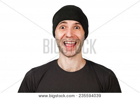 Young Funny Smiling Man With Wide Eyes In Hat Isolated On White.
