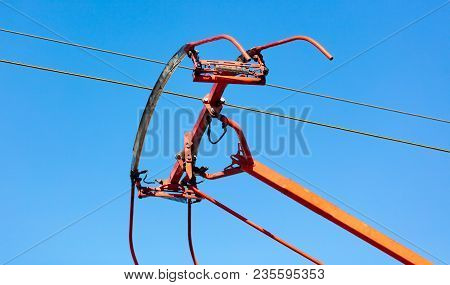Tram Wires Against The Blue Sky In The City