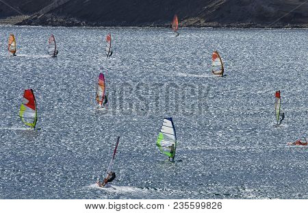 Windsurfers Rides On The Brilliant Waves Of The Beautiful Mediterranean Sea On Cape Prasonisi (rhode
