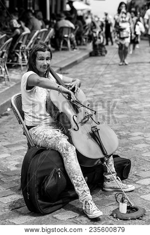 Paris, France - July 06, 2017: Street Musician Is Playing Cello Outdoor At The Tertre Square (place 