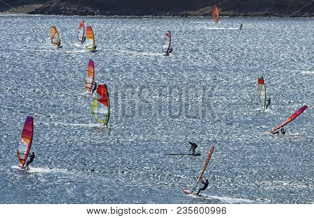 Windsurfers Rides On The Brilliant Waves Of The Beautiful Mediterranean Sea On Cape Prasonisi (rhode