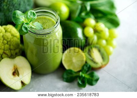 Glass Jar Mugs With Green Health Smoothie, Kale Leaves, Lime, Apple, Kiwi, Grapes, Banana, Avocado, 