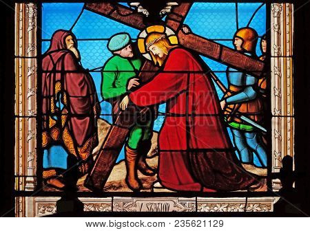 PARIS, FRANCE - JANUARY 10: 5th Stations of the Cross, Simon of Cyrene carries the cross, stained glass windows in the Saint Eugene - Saint Cecilia Church, Paris, France on January 10, 2018.