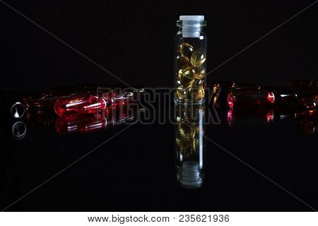 Pill Bottle And Pills In Isolated On Black Concept Pharmacy. With Copy Space.