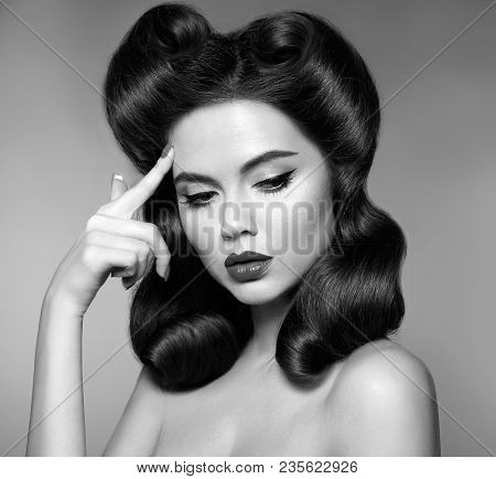 Nostalgia. Pin Up Girl With Red Lips Makeup And Retro Curls Hair Style. Retro Woman Looking To The S