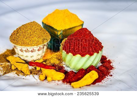 Close Up Of Three Basic Spices Of Indian Asian Food That Are Red Pepper Powder, Turmeric Powder And 