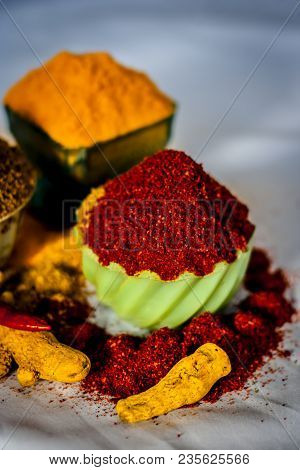 Close Up Of Three Basic Spices Of Indian Asian Food That Are Red Pepper Powder, Turmeric Powder And 