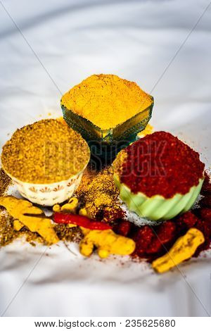 Close Up Of Three Basic Spices Of Indian Asian Food That Are Red Pepper Powder, Turmeric Powder And 