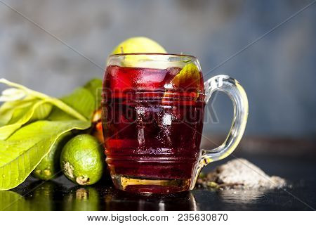 Close Up Of Popular Indian Shrabat Of Guava With Sugar And Masala In A Glass With Raw Fresh Guava On