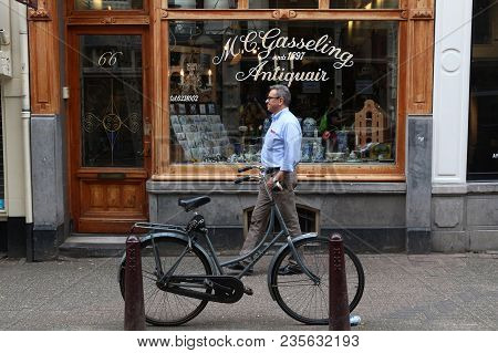 Amsterdam, Netherlands - July 10, 2017: Person Walks Along Nieuwe Spiegelstraat, Antique Shopping St