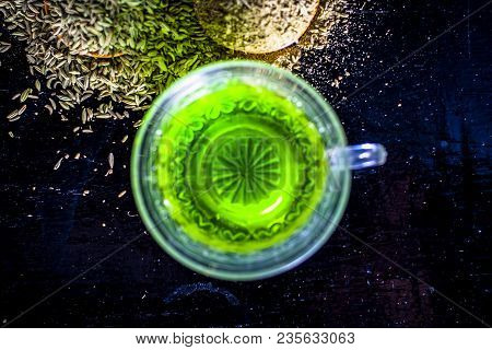 Closes Up Of Essential Tea Of Raw Fresh Fennel Seeds With Raw Fennel Seeds In A Transparent Cup On W