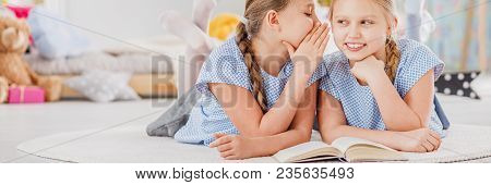 Girl Whispering Secrets To Friend