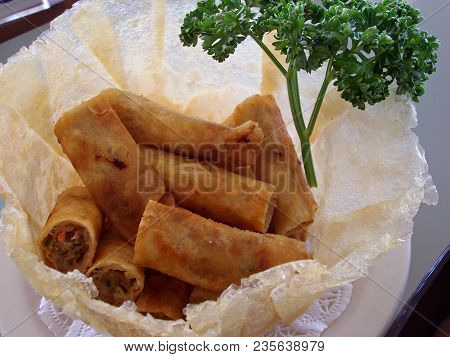 Lumpia Or  Vegetable Spring Rolls
Vegetable Rolls Deep Fried And Served On A Fresh Spring Roll Wrapp