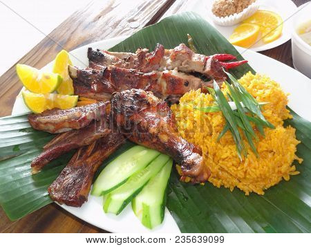 Chamorro Beef And Chicken Barbeque Meal With Yellow Rice In Banana Leaves
Authentic Chamorro Favorit