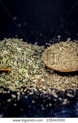 Close Up Of Raw Dried Fennel Seeds Or Variyali Or Foeniculum Vulgare On A Wooden Surface With Its Po