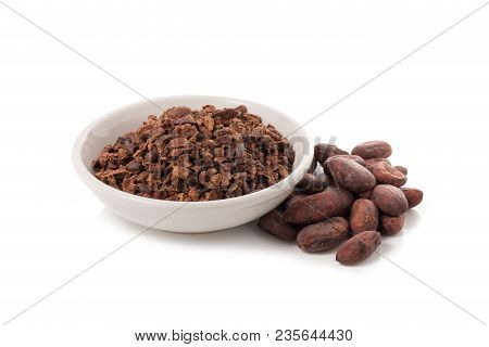 Bowl Of Cacao Nibs Isolated On A White Background.