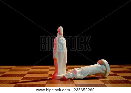 Chess Photographed On A Chessboard And Dark Background