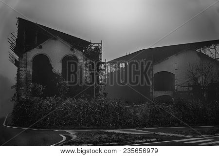 Old House With A Ghost On The Road In The Morning Horror House In Fog. Old Mystic Building In Dead T