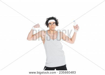 Thin Portsman Holding Bottle Of Water And Showing Muscles Isolated On White