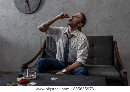 Businessman With Drug Addiction Taking Mdma Pill