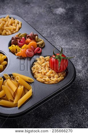 Various Type Of Pasta And Cherry Tomato. Top View