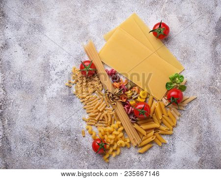Various Type Of Pasta And Cherry Tomato. Top View