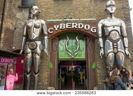 London, United Kingdom -- March 23, 2018: People Gather In Front Of The Giant Robots At The Entrance