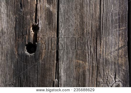 Background Of An Old Rough Board With Knots And Furrows