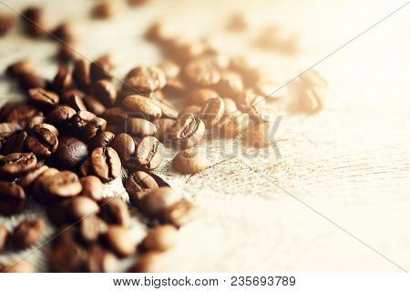Coffee Beans On Light Wooden Background With Copyspace For Text. Coffee Background, Food Frame, Text