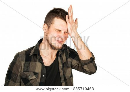 Young Guy With Beard And Modern Hairstyle Mohawk, Oblivious And Holds Hand At The Head Isolated On W