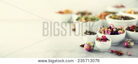 Assortment Of Dry Tea In White Bowls. Tea Backgound: Green, Black, Floral, Herbal, Mint, Melissa, Gi