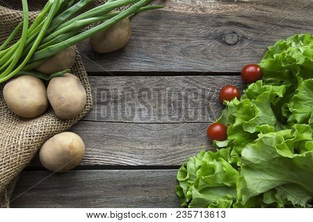 Fresh Garden Herbs On Wooden Table Board. Top View With Copy Space