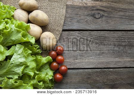 Fresh Garden Herbs On Wooden Table Board. Top View With Copy Space