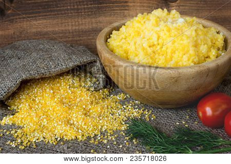Cooked Corn Grits In Bowl, A Baggie Of Dry Cereal, Tomato And Fennel.