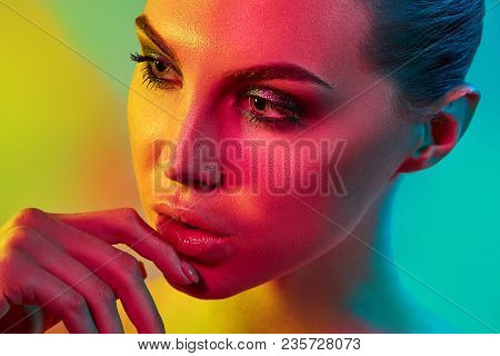 High Fashion Model Woman In Colorful Bright Lights Posing In Studio, Portrait Of Beautiful Sexy Girl