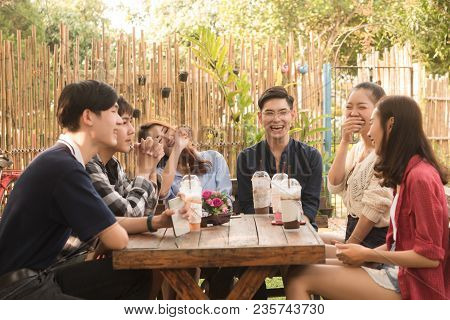 Group Of Friends Hang Out In Cafe