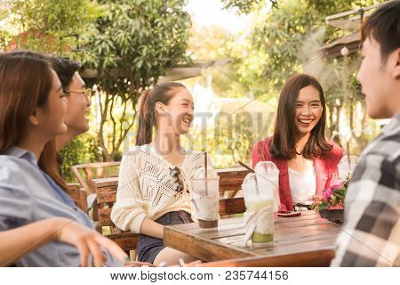 Group Of Friends Hang Out In Cafe