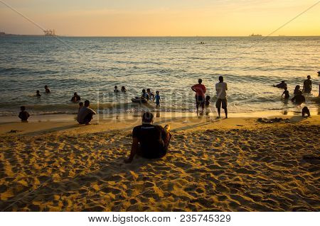 Lumut Perak, Malaysia - March 20, 2018: People Swimming At Beach Of Teluk Batik. Teluk Batik Beach I