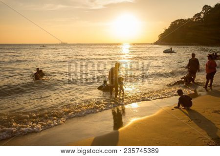 Lumut Perak, Malaysia - March 20, 2018: People Swimming At Beach Of Teluk Batik. Teluk Batik Beach I