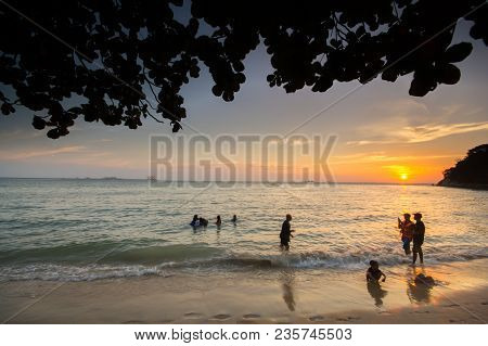 Lumut Perak, Malaysia - March 20, 2018: People Swimming At Beach Of Teluk Batik. Teluk Batik Beach I