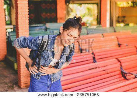 Travel Concept. Beautiful Girl Is Having Severe Stomach Pain While Traveling. Asian Women Are Not Co