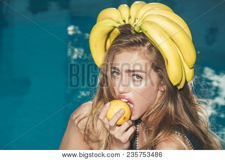 Summer Vacation And Travel To Ocean. Sexy Woman With Tropical Fruit In Pool. Vitamin In Banana At Gi