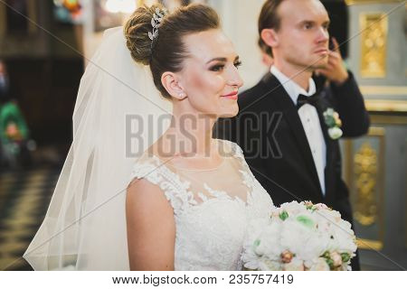 Wedding Couple Bide And Groom Get Married In A Church.