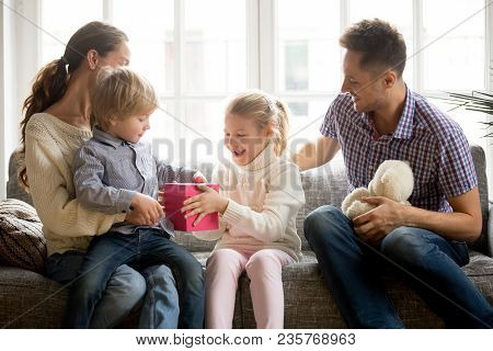 Sister Presenting Gift For Little Brother Giving Cute Boy Box With Present, Excited Kid Girl Making 